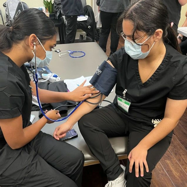 students training to take blood pressure counts students training to take blood pressure counts